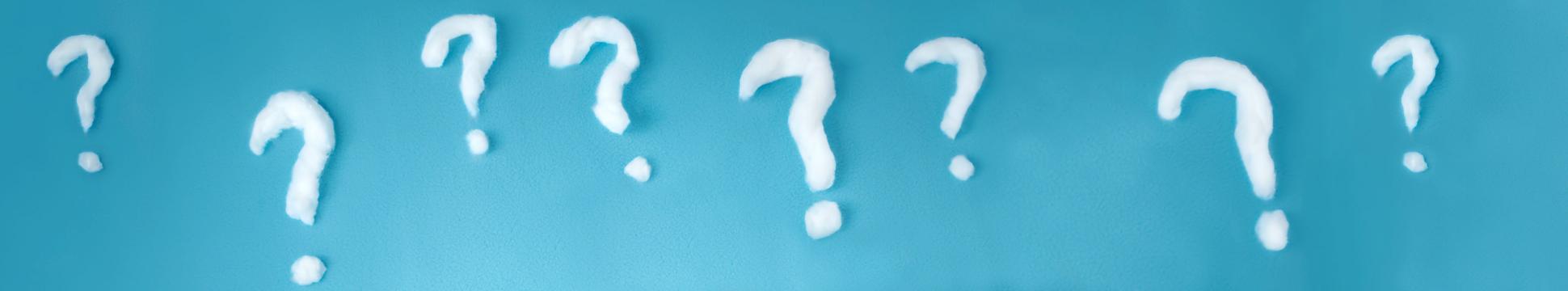 photo of questions marks on a blue background