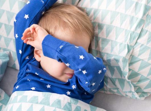 photo of a little boy struggling to sleep